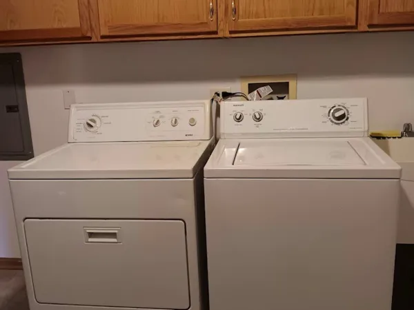 a close up view of washer and dryer with washer and dryer