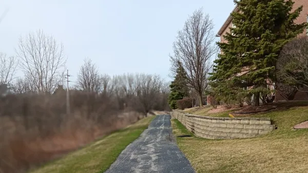 a view of a water fountain in the backyard of a house