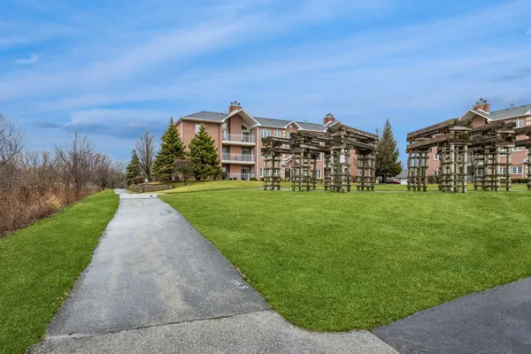 a view of a building with a yard