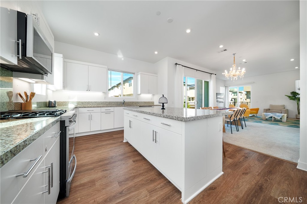 1602 West Bushell Street Anaheim, CA 92805 - Photo 17 of 31 a kitchen with lots of counter top space and appliances