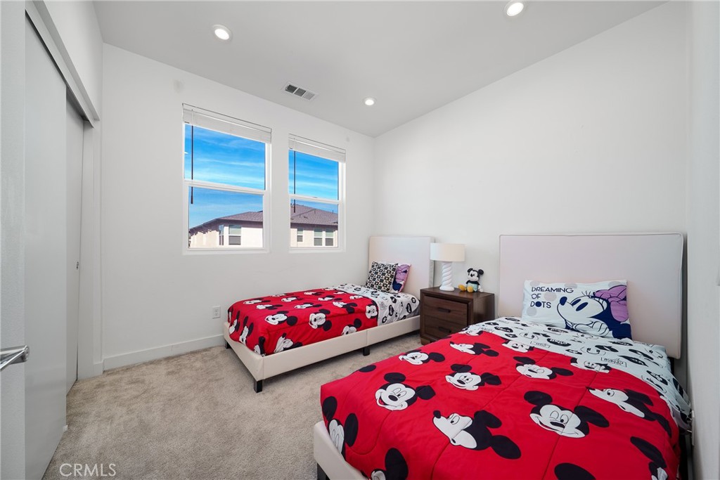 1602 West Bushell Street Anaheim, CA 92805 - Photo 20 of 31 a bedroom with two beds and a dresser