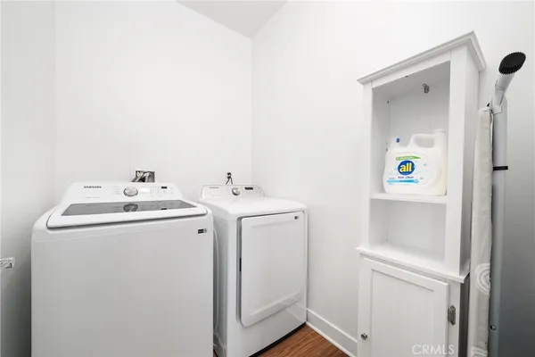a bathroom with a bathtub shower sink vanity and toilet