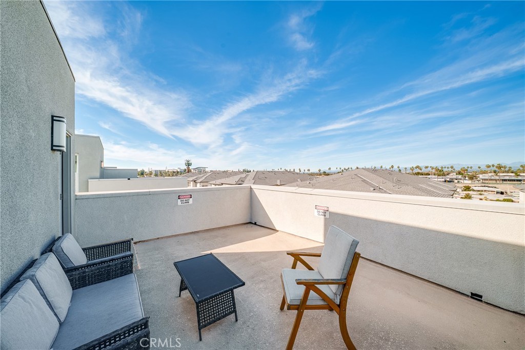 1602 West Bushell Street Anaheim, CA 92805 - Photo 27 of 31 a view of a terrace with furniture and a city view