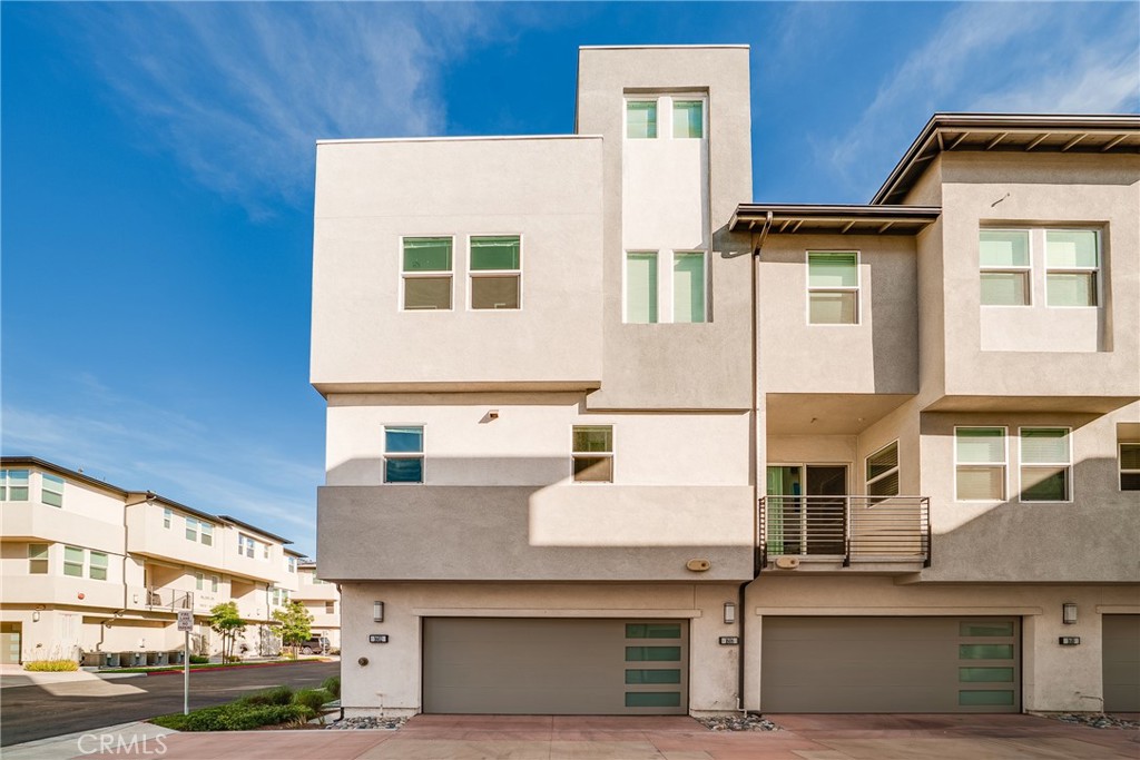 1602 West Bushell Street Anaheim, CA 92805 - Photo 5 of 31 a view of a white building among the street