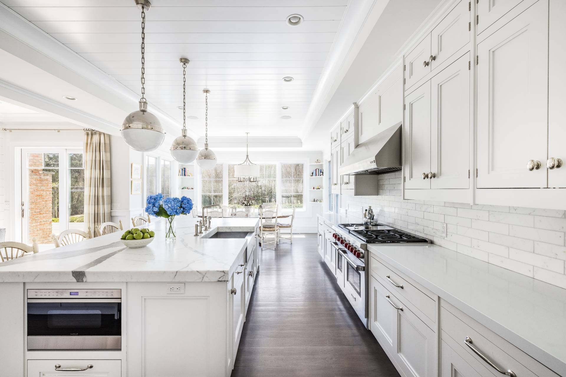 135 Hildreth Lane Bridgehampton, NY 11932 - Photo 7 of 33 a kitchen with stainless steel appliances a stove a sink and cabinets