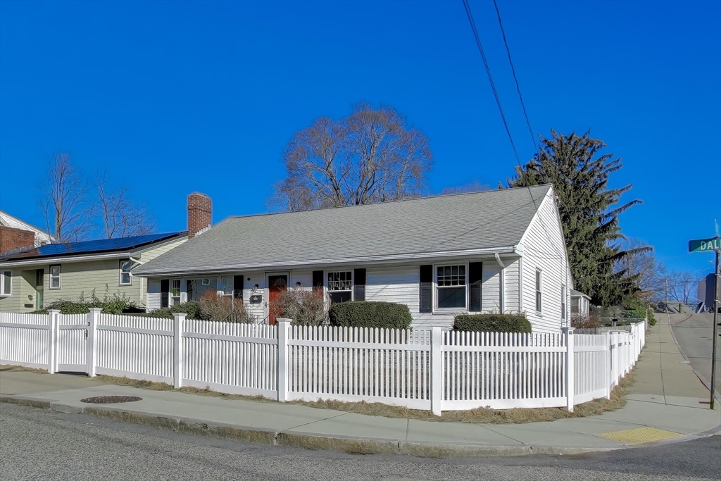 76 Dale Street Boston, MA 02131 - Photo 2 of 29 a view of a house with a small yard and plants