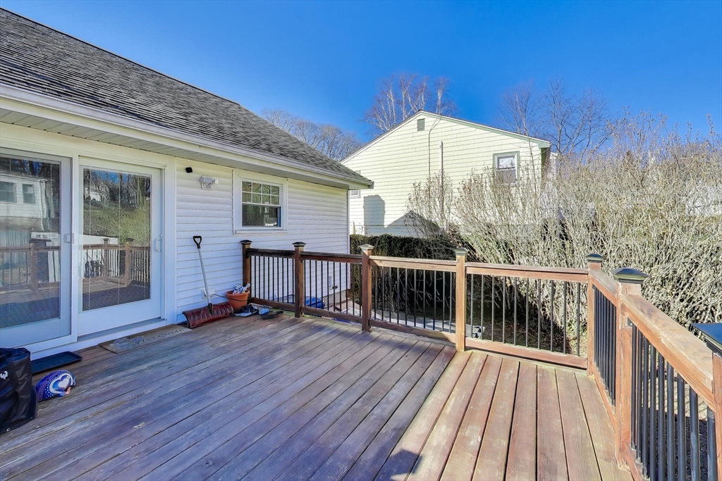76 Dale Street Boston, MA 02131 - Photo 22 of 29 a view of balcony with wooden floor and fence