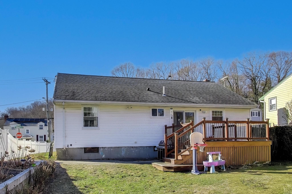 76 Dale Street Boston, MA 02131 - Photo 25 of 29 a view of an house with backyard space and balcony