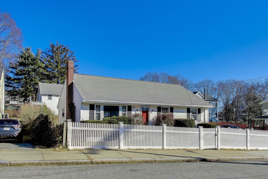 76 Dale Street Boston, MA 02131 - Photo 3 of 29 a front view of a house with a garden