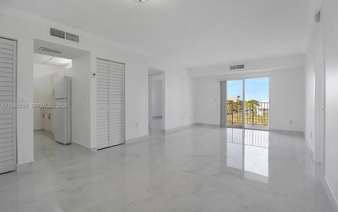8260 Southwest 210th Street, Unit 302 Cutler Bay, FL 33189 - Photo 18 of 42 wooden floor in an empty room
