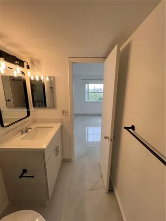 a bathroom with a shower a toilet and a shower