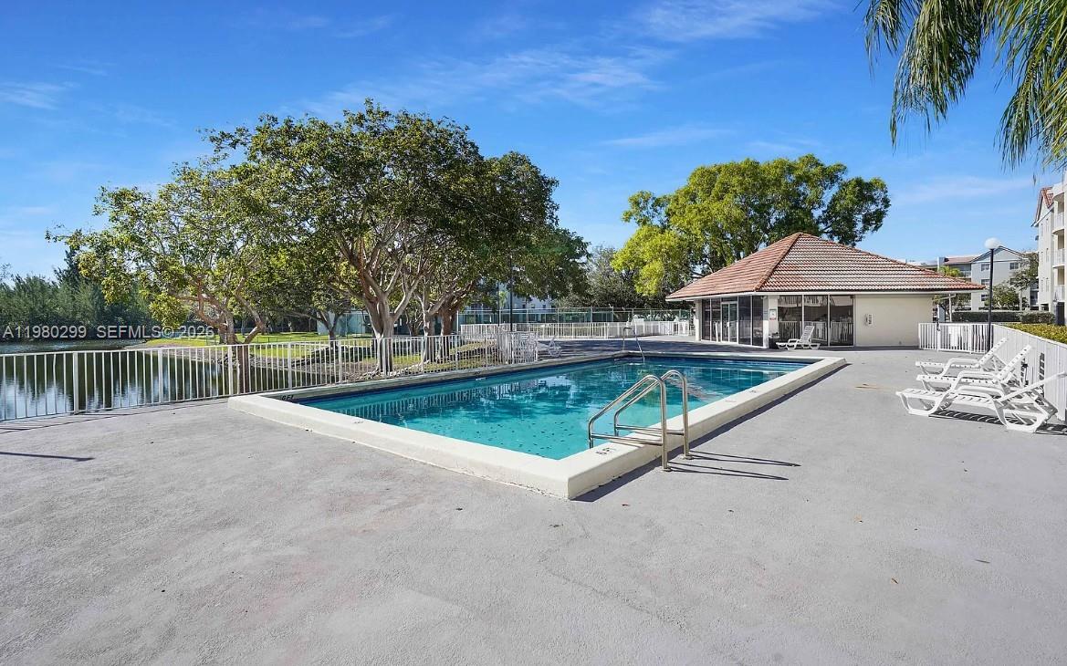8260 Southwest 210th Street, Unit 302 Cutler Bay, FL 33189 - Photo 8 of 42 a view of pool with a yard