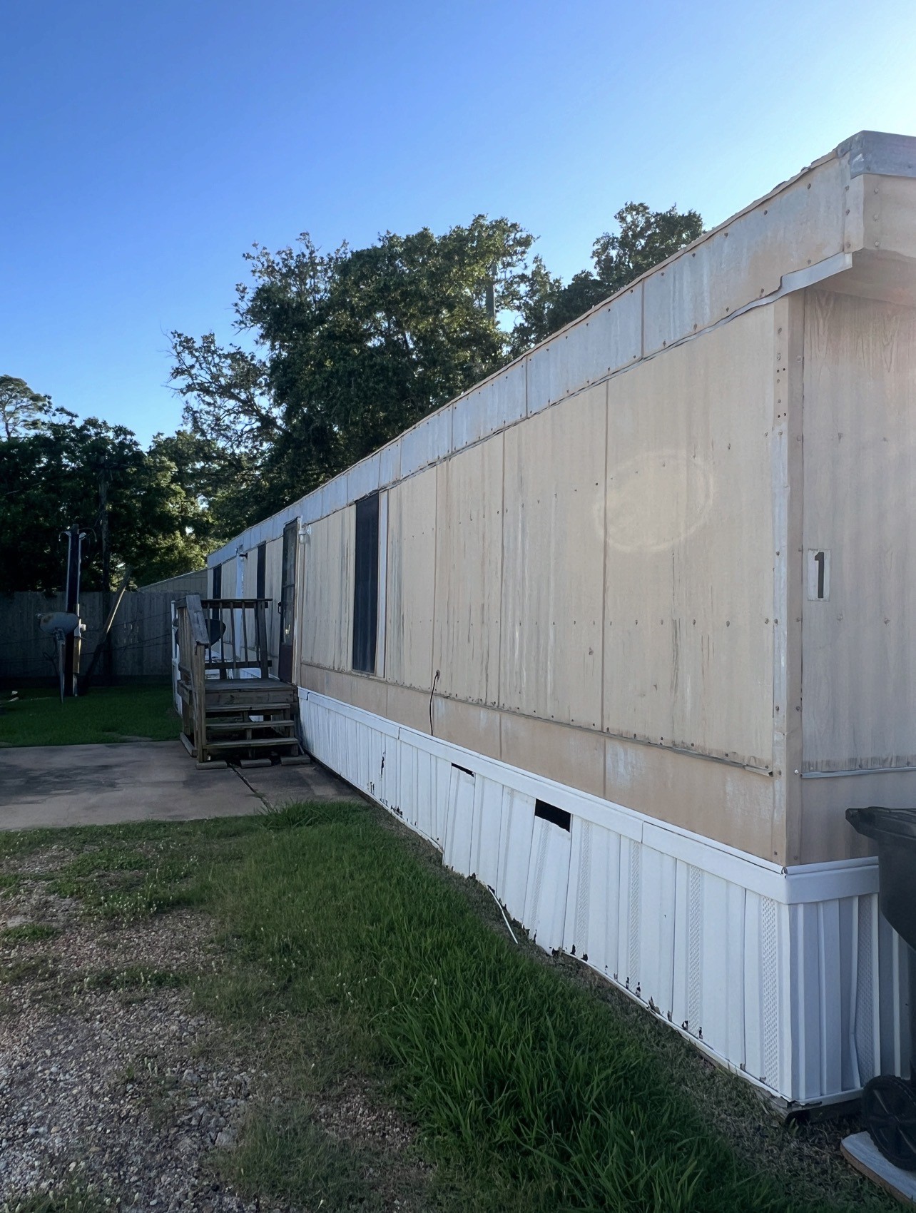 1511-1 Jones Street, Unit 1 Rosenberg, TX 77471 - Photo 2 of 13 a backyard of a house with wooden fence