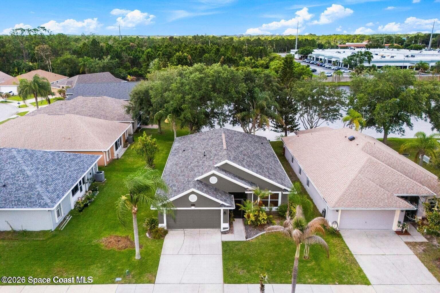 4741 Decatur Circle Melbourne, FL 32934 - Photo 29 of 44 an aerial view of a house with a yard