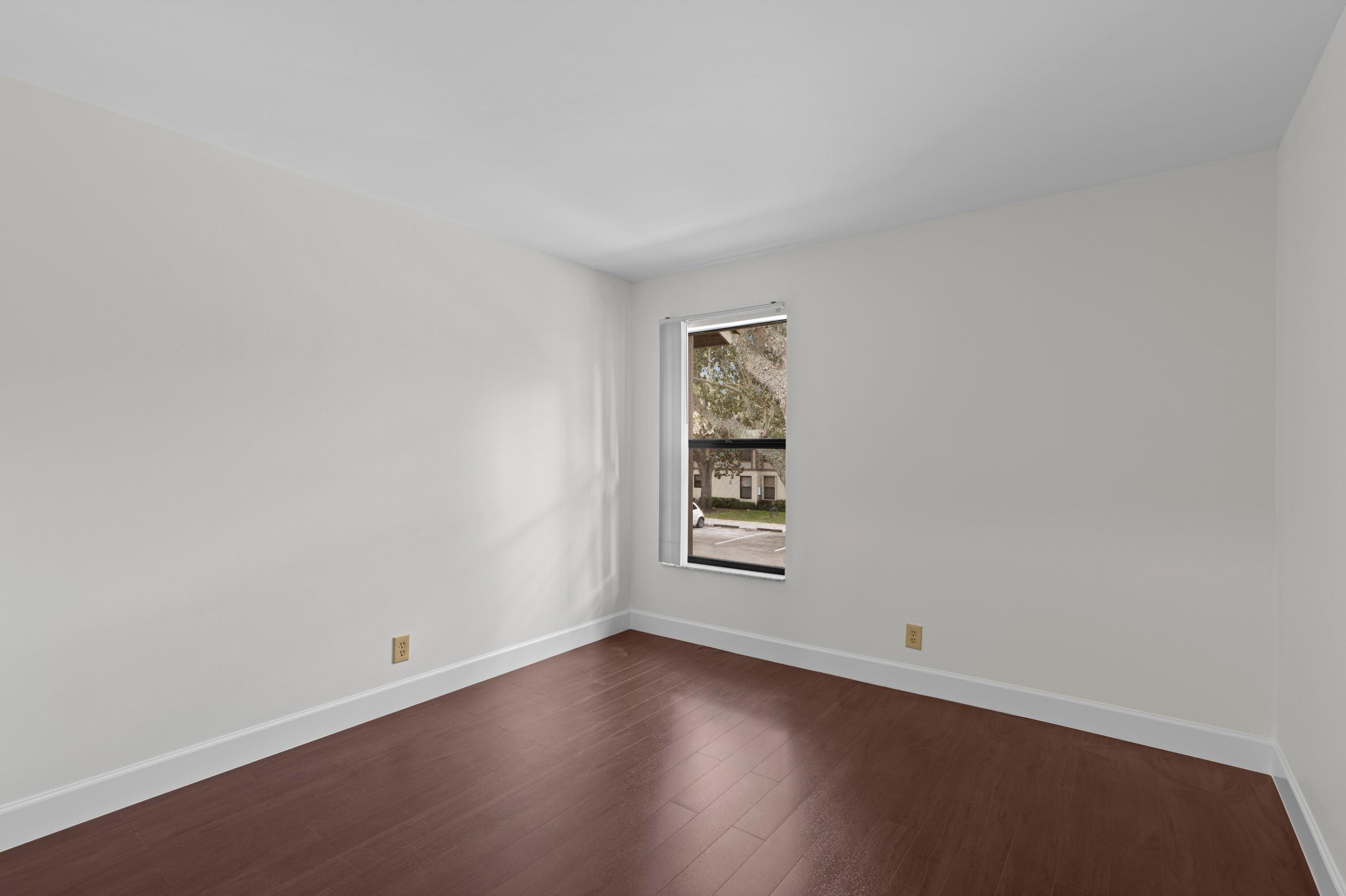 3139 Millwood Terrace, Unit M225 Boca Raton, FL 33431 - Photo 11 of 25 an empty room with windows