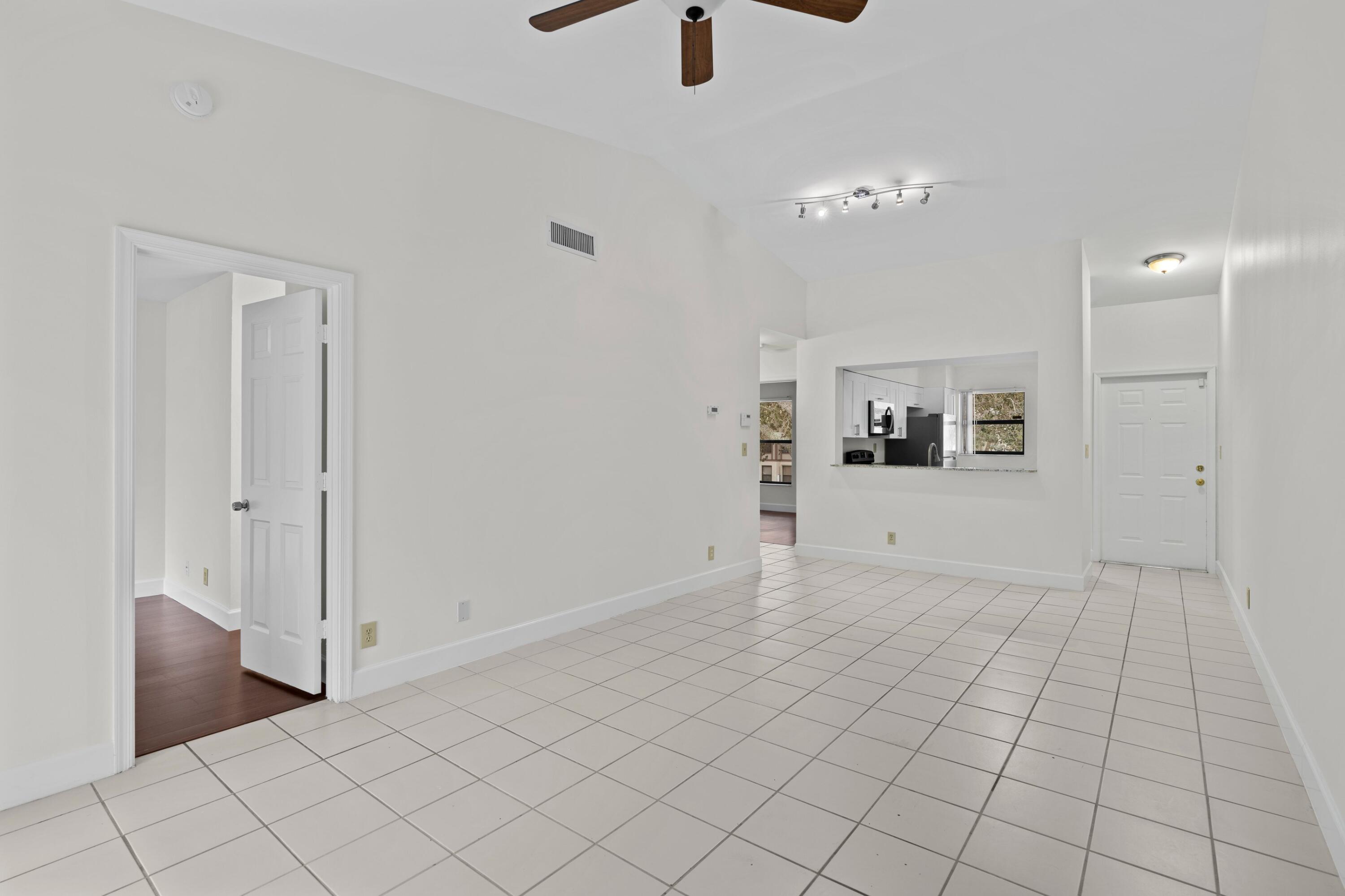 3139 Millwood Terrace, Unit M225 Boca Raton, FL 33431 - Photo 5 of 25 an empty room with closet and windows