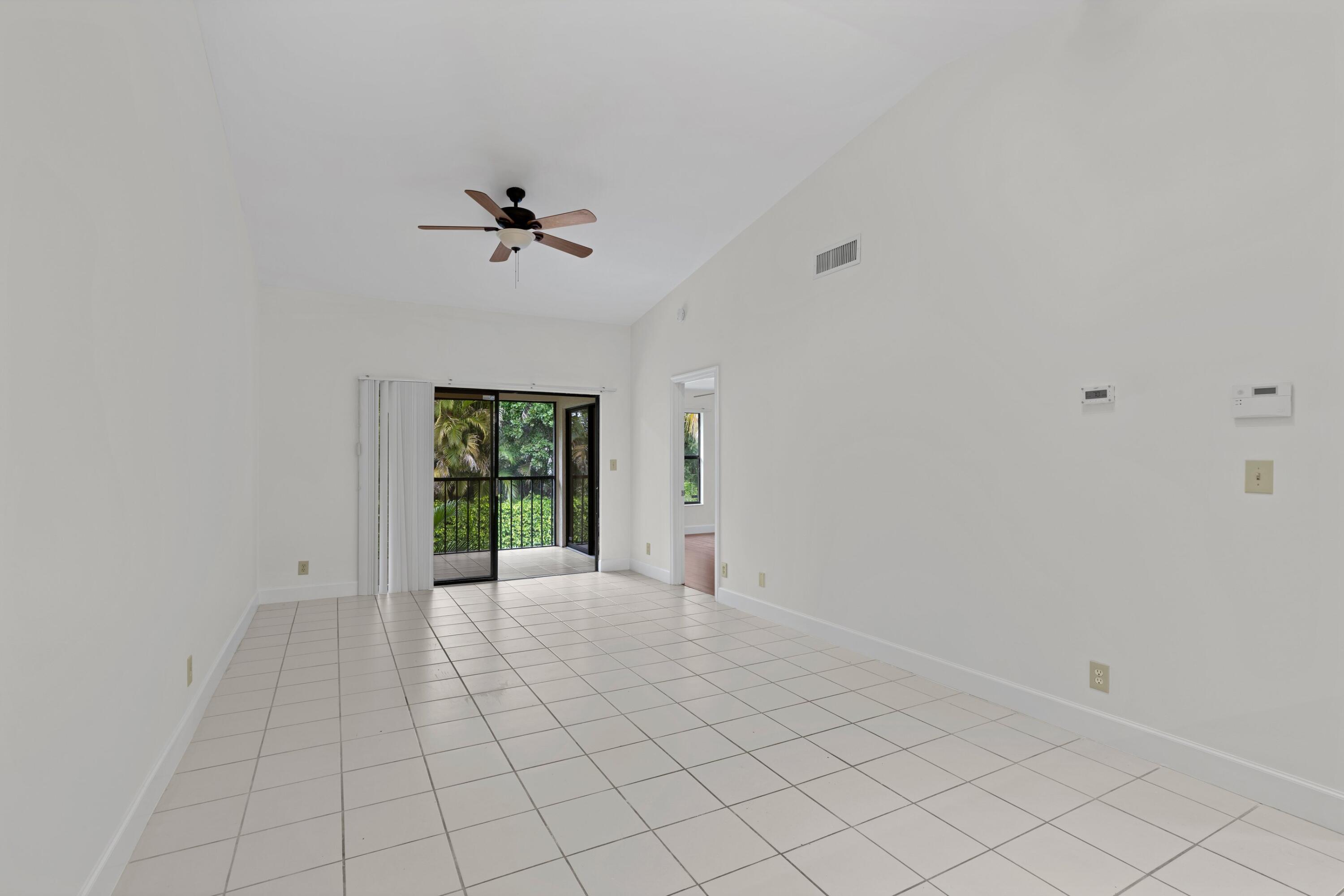 3139 Millwood Terrace, Unit M225 Boca Raton, FL 33431 - Photo 6 of 25 a view of an empty room with a window