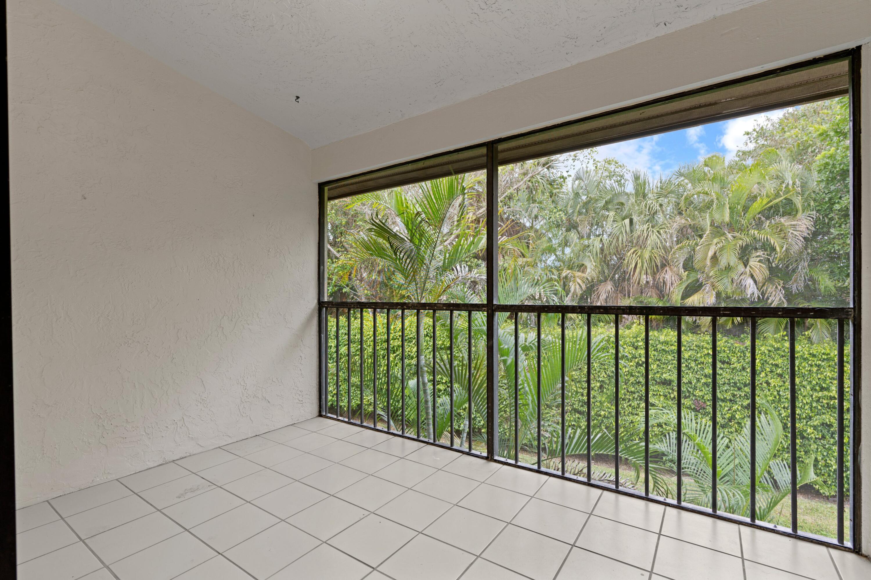3139 Millwood Terrace, Unit M225 Boca Raton, FL 33431 - Photo 7 of 25 a view of a garden from a window