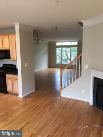 a view interior of a house with wooden floor windows and a fireplace