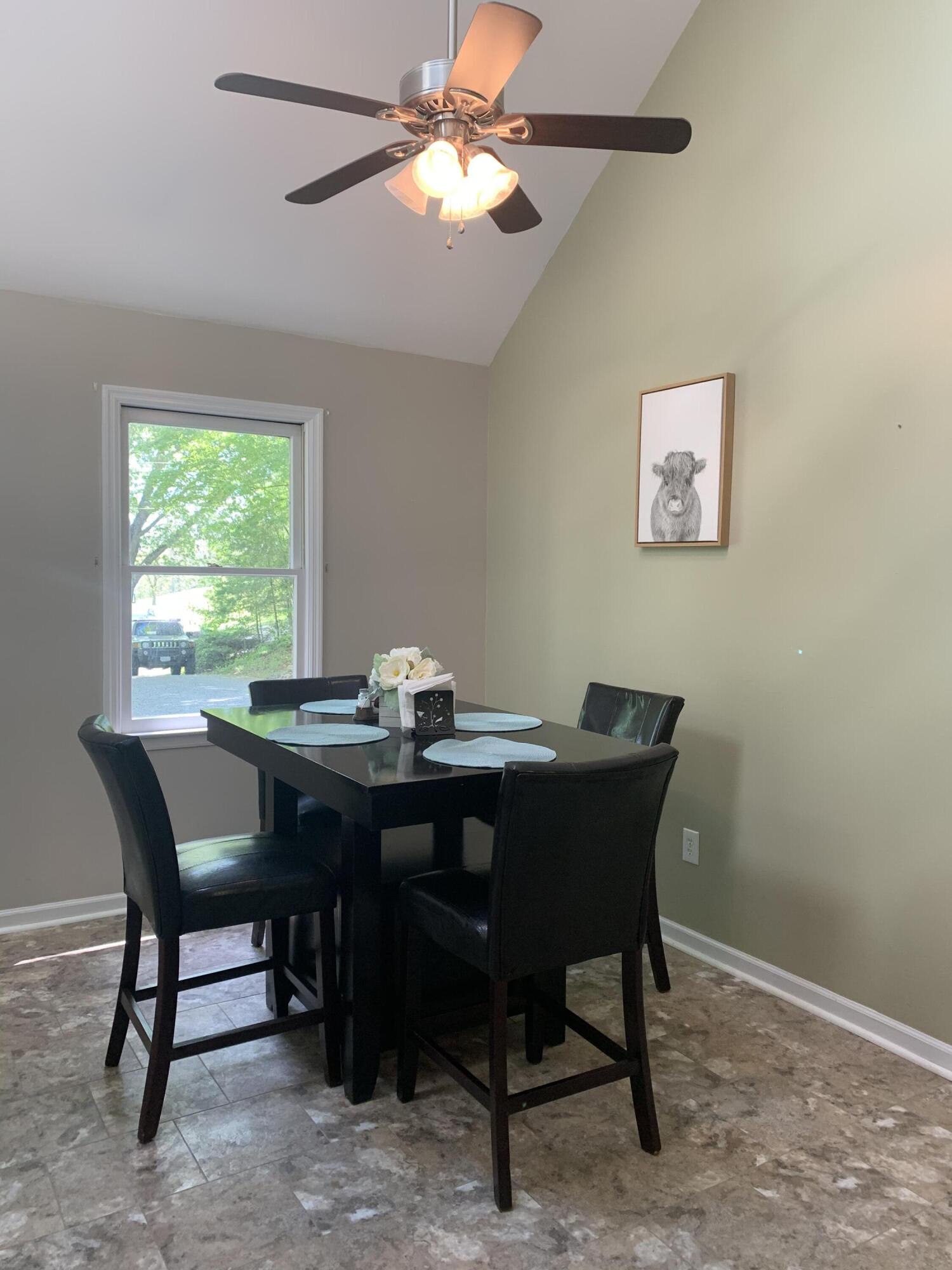 357 London Ridge Road Boones Mill, VA 24065 - Photo 12 of 28 a view of a dining room with a table and chairs