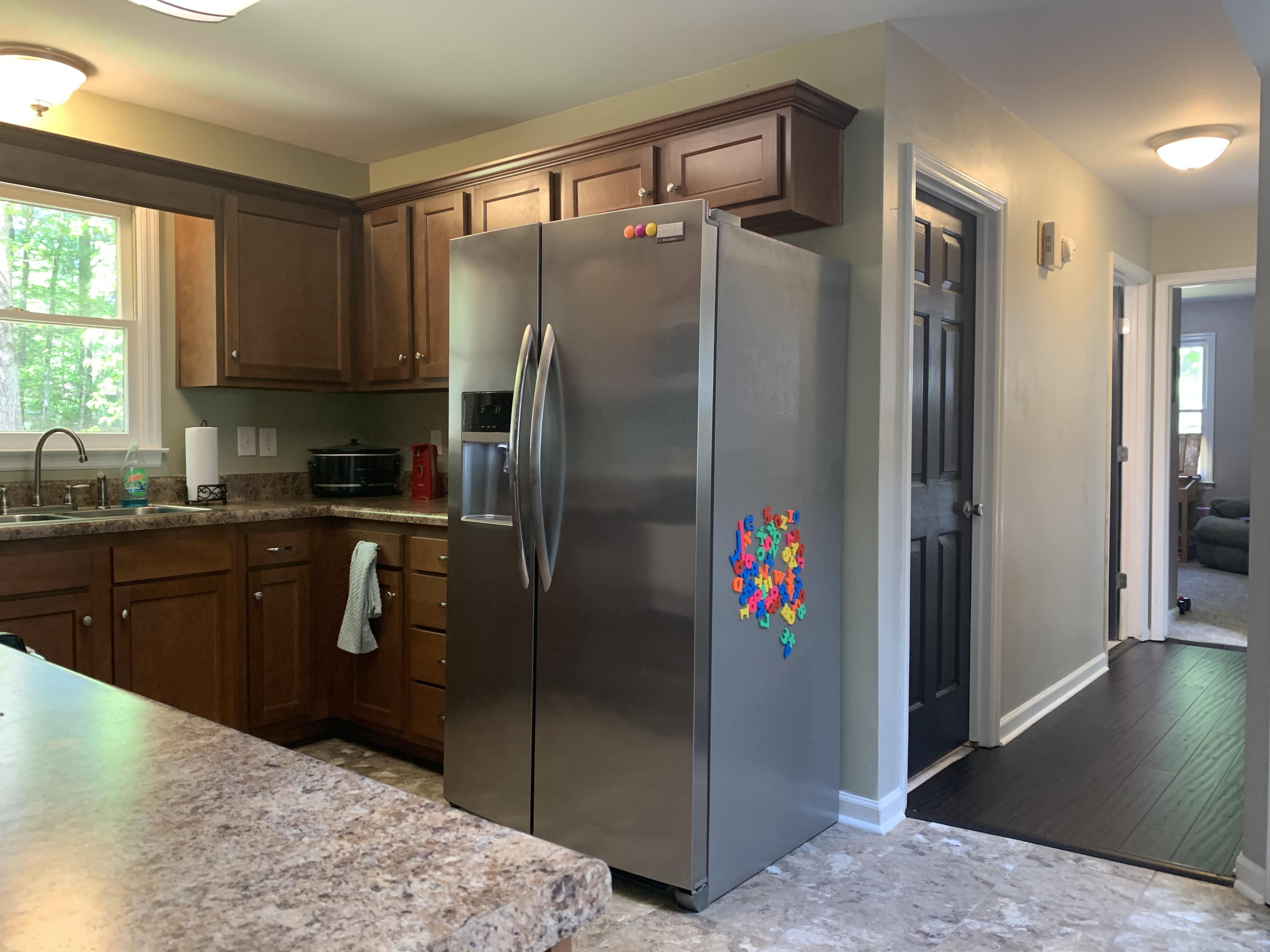 357 London Ridge Road Boones Mill, VA 24065 - Photo 13 of 28 a kitchen with stainless steel appliances granite countertop a refrigerator and a sink