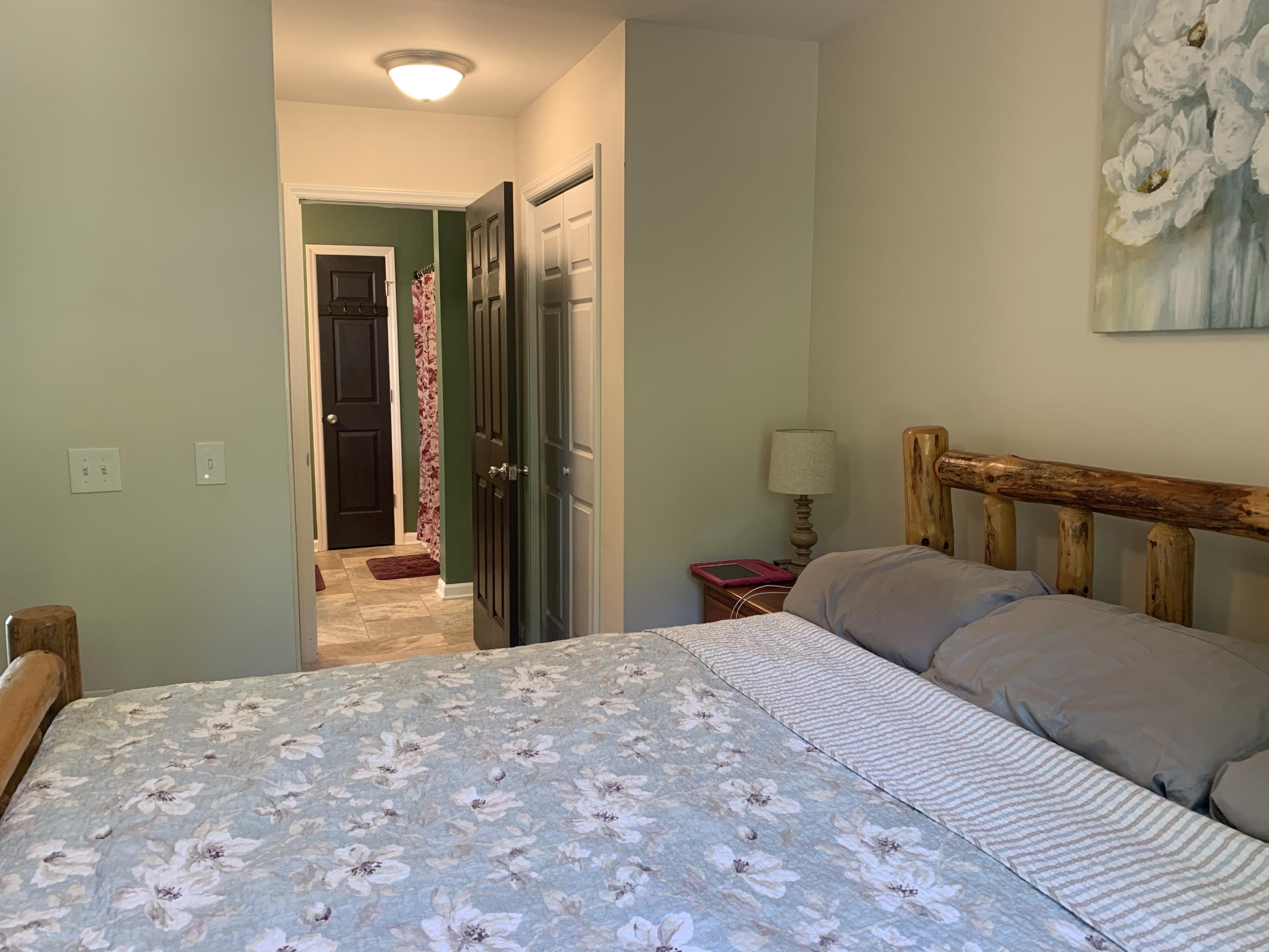 357 London Ridge Road Boones Mill, VA 24065 - Photo 17 of 28 a bedroom with a bed and chair