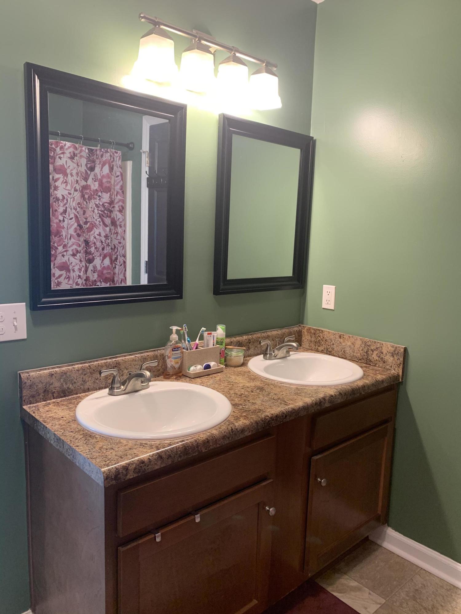 357 London Ridge Road Boones Mill, VA 24065 - Photo 18 of 28 a bathroom with a granite countertop sink and a mirror
