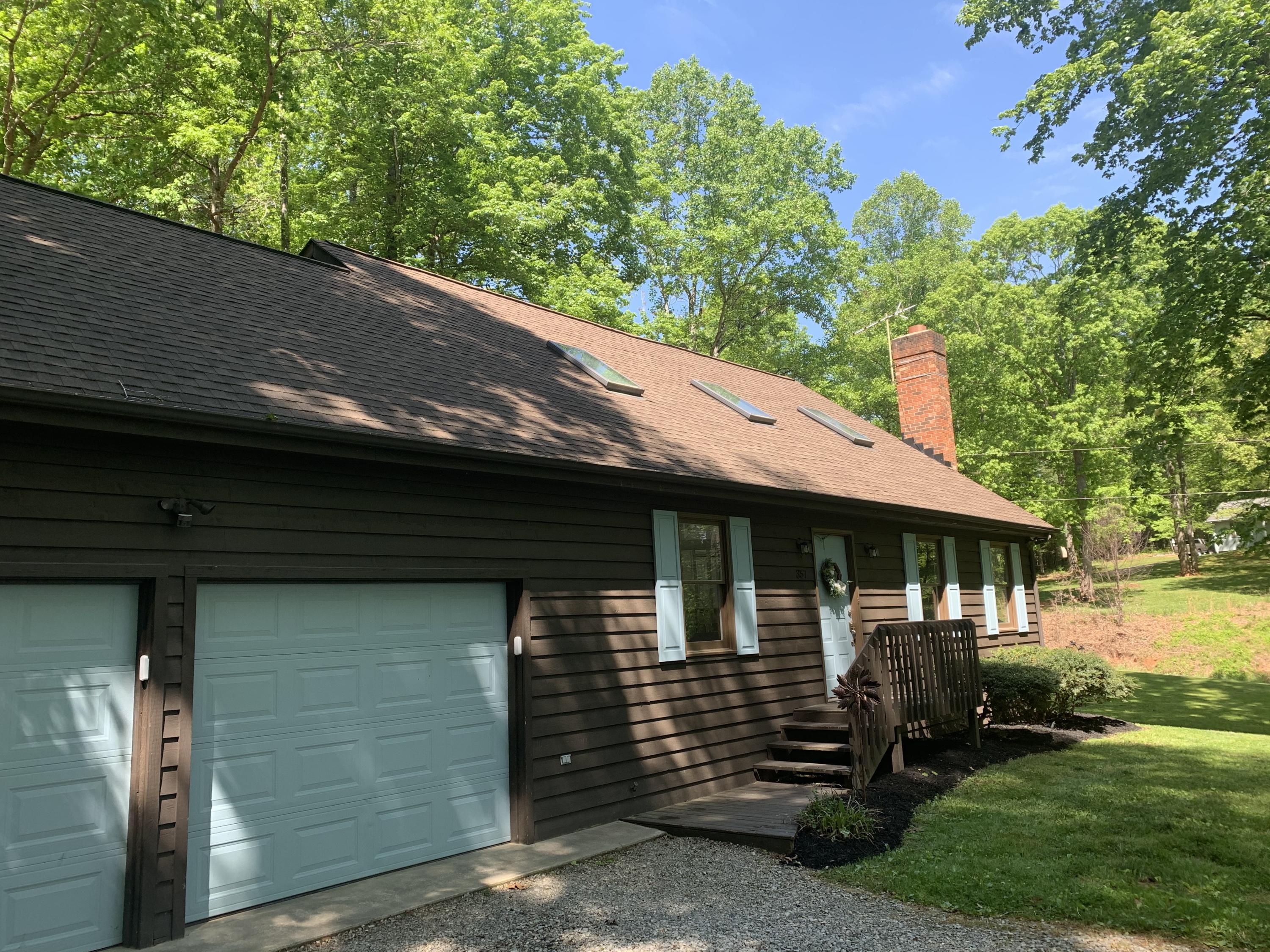 357 London Ridge Road Boones Mill, VA 24065 - Photo 27 of 28 a backyard of a house with lots of green space