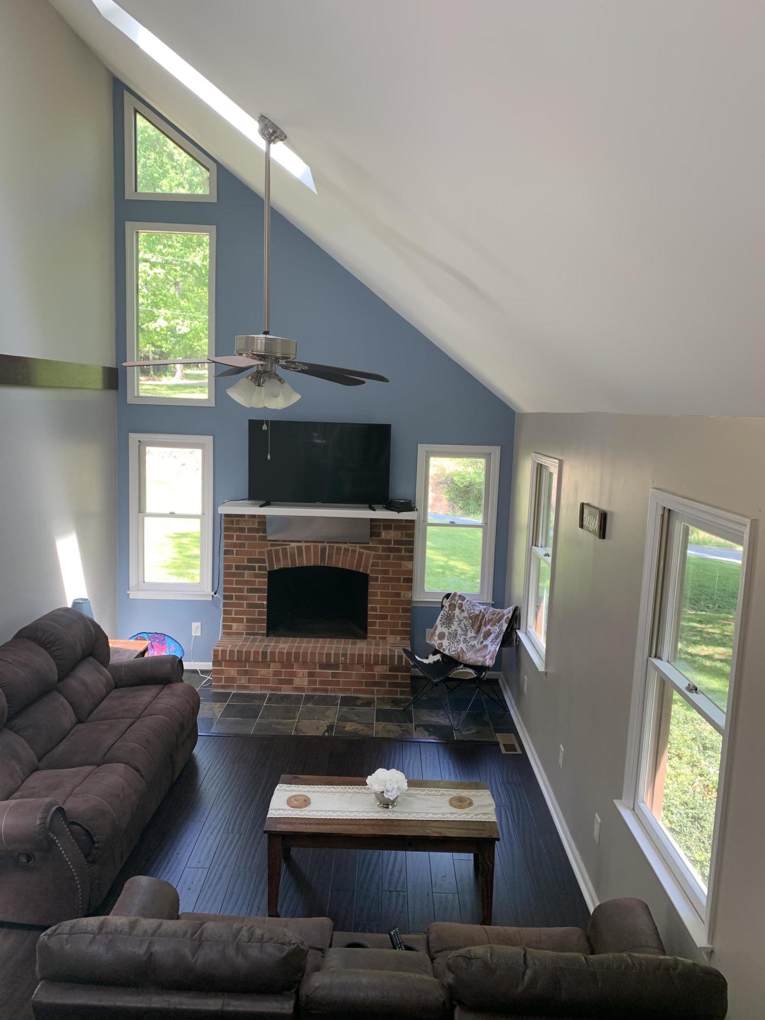 357 London Ridge Road Boones Mill, VA 24065 - Photo 4 of 28 a living room with furniture and a fireplace
