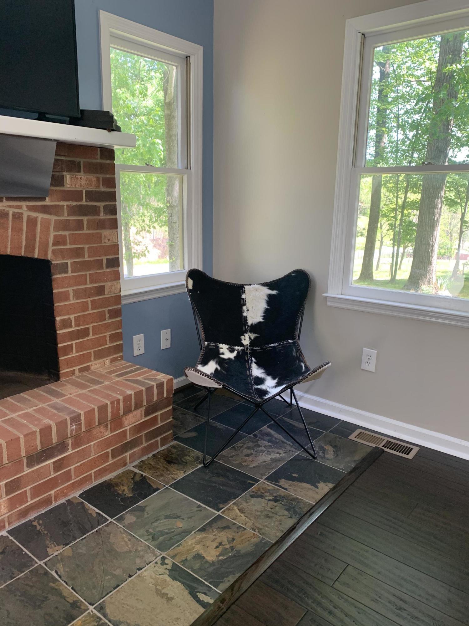 357 London Ridge Road Boones Mill, VA 24065 - Photo 6 of 28 a living room with furniture windows and a fireplace