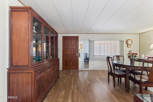 a view of a dining room with furniture window and wooden floor