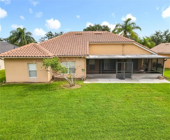 an aerial view of residential houses with outdoor space and swimming pool