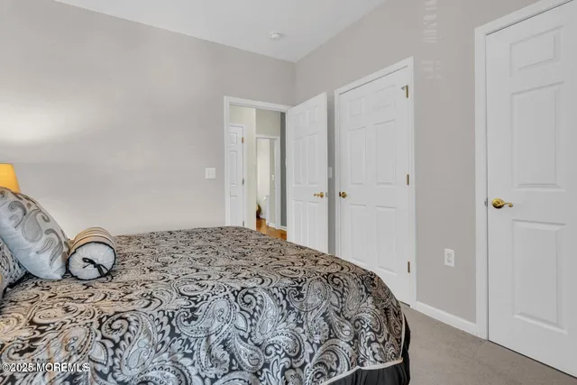 a bedroom with bed and a window