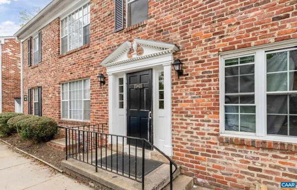 a view of a brick house with a large window