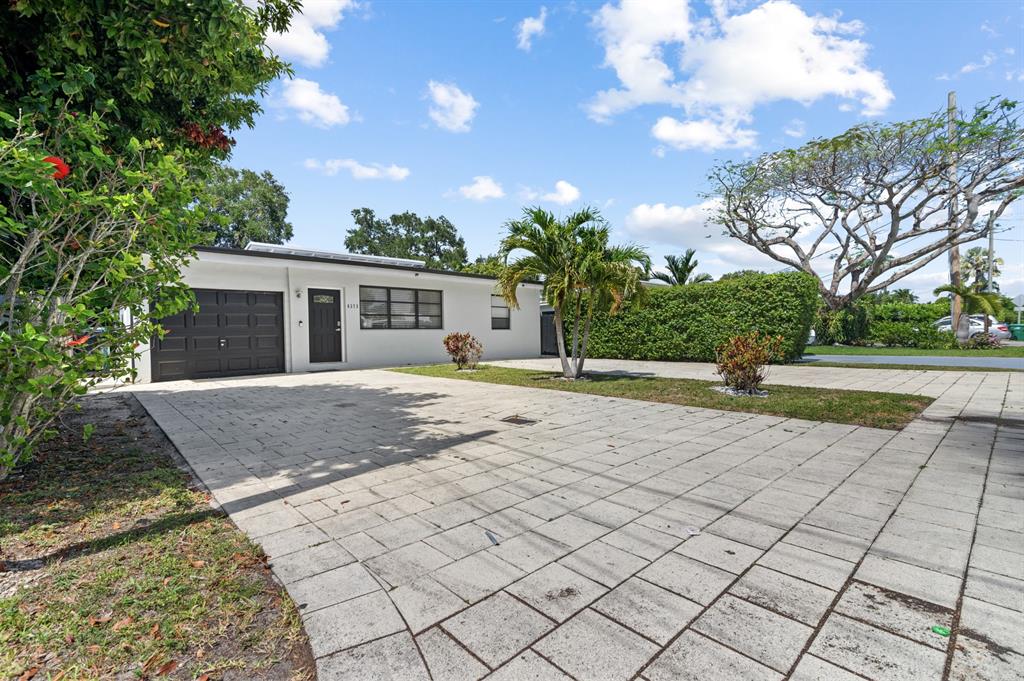 6375 Southwest 29th Street Miami, FL 33155 - Photo 1 of 51 a view of yellow house with a yard