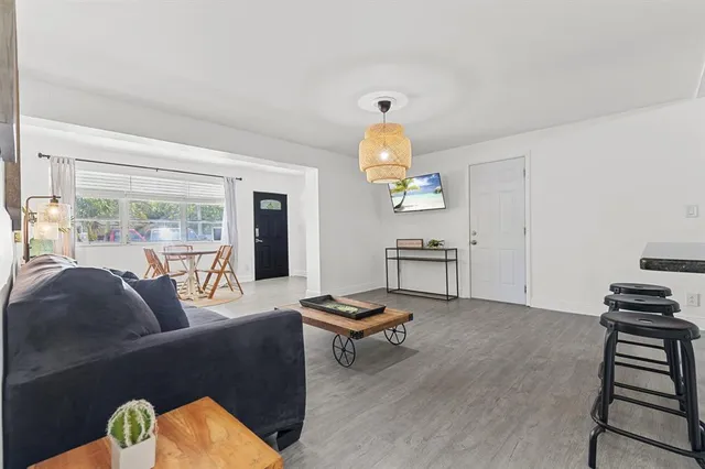 a living room with furniture and a window