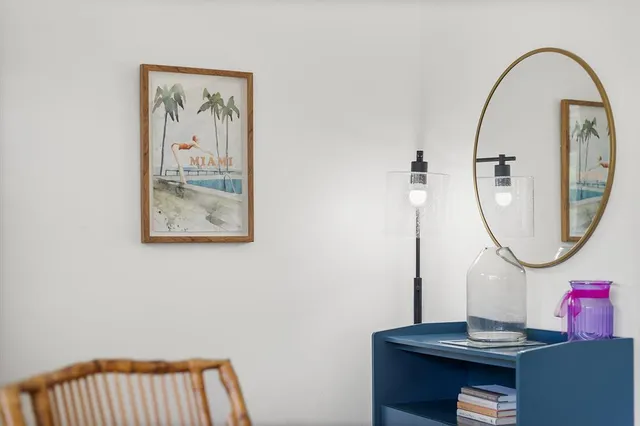 a view of a room with a mirror and a table