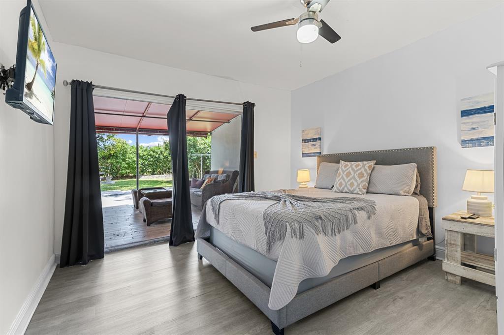 6375 Southwest 29th Street Miami, FL 33155 - Photo 21 of 51 a large bed sitting in a bedroom next to a window