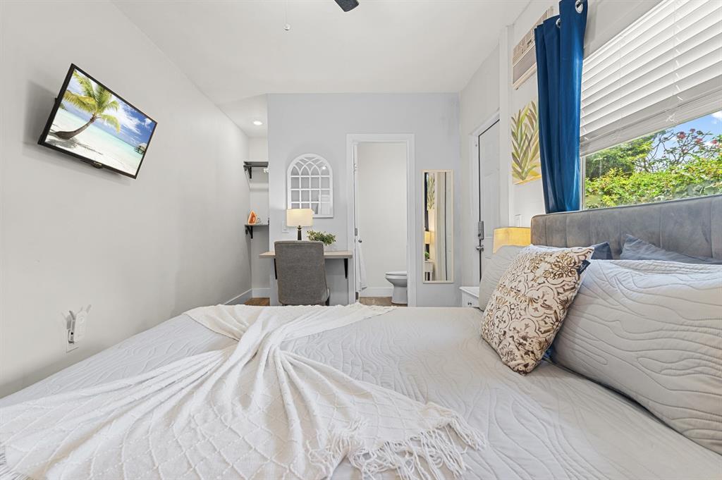 6375 Southwest 29th Street Miami, FL 33155 - Photo 32 of 51 a bedroom with a bed and a large window