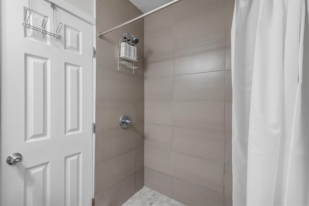 6375 Southwest 29th Street Miami, FL 33155 - Photo 34 of 51 a bathroom with a glass shower door