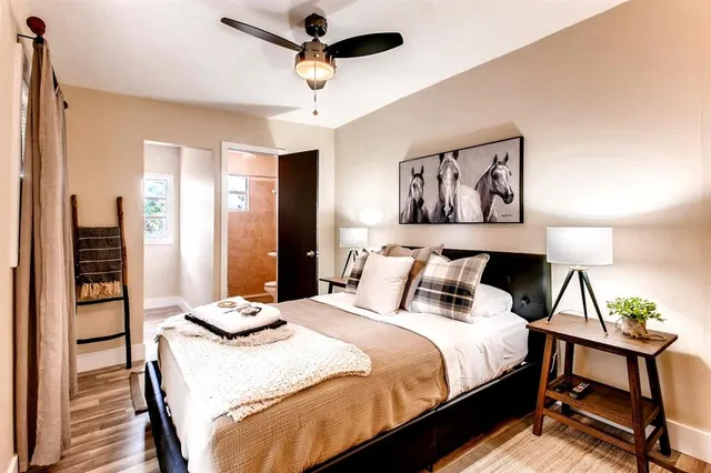 a bedroom with a bed and a table in it