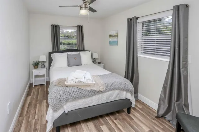 a bedroom with a bed and chair