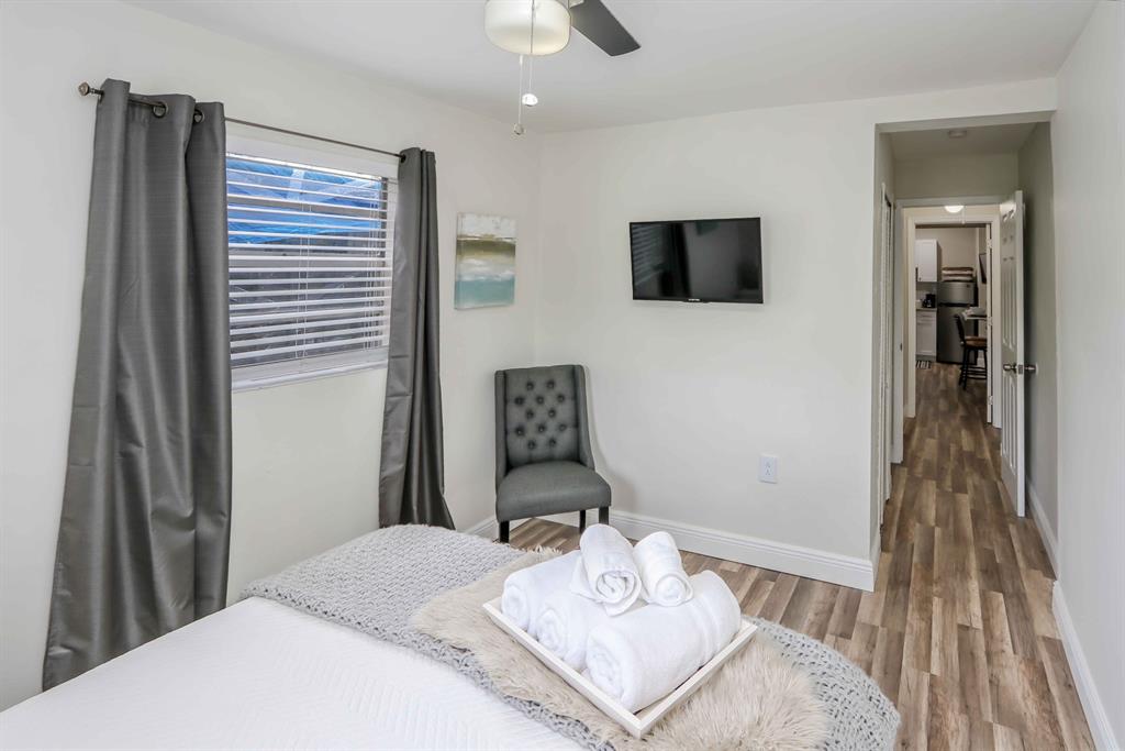 6375 Southwest 29th Street Miami, FL 33155 - Photo 44 of 51 a bedroom with a bed and a flat screen tv