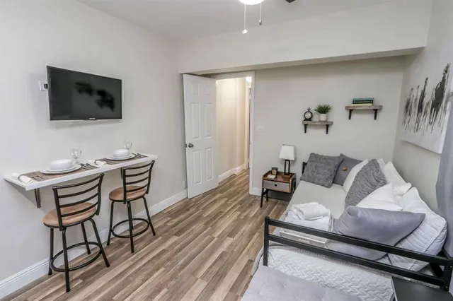 a bed room with a bed and a chair