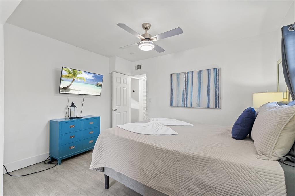 6375 Southwest 29th Street Miami, FL 33155 - Photo 7 of 51 a bedroom with a bed and a chandelier