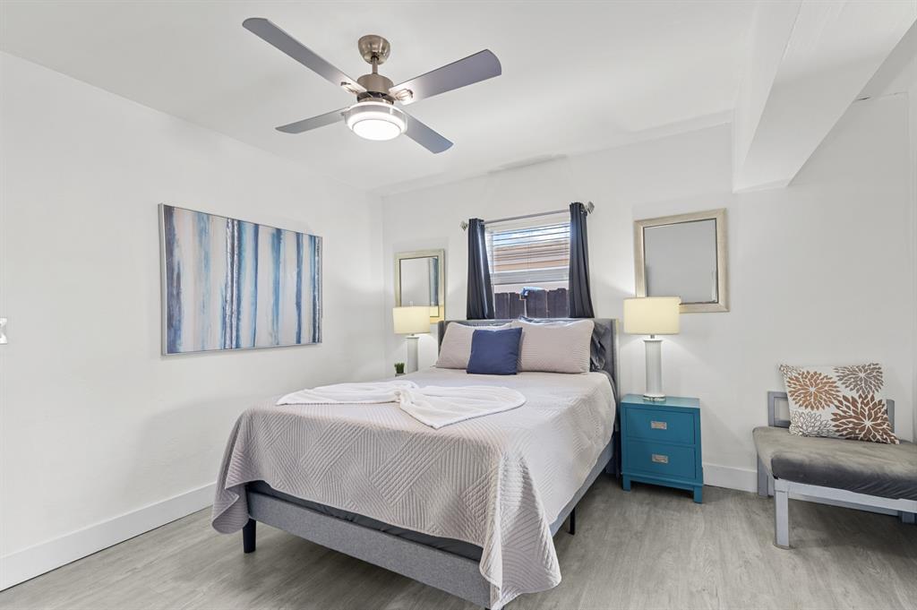 6375 Southwest 29th Street Miami, FL 33155 - Photo 8 of 51 a bedroom with a bed chandelier and a window