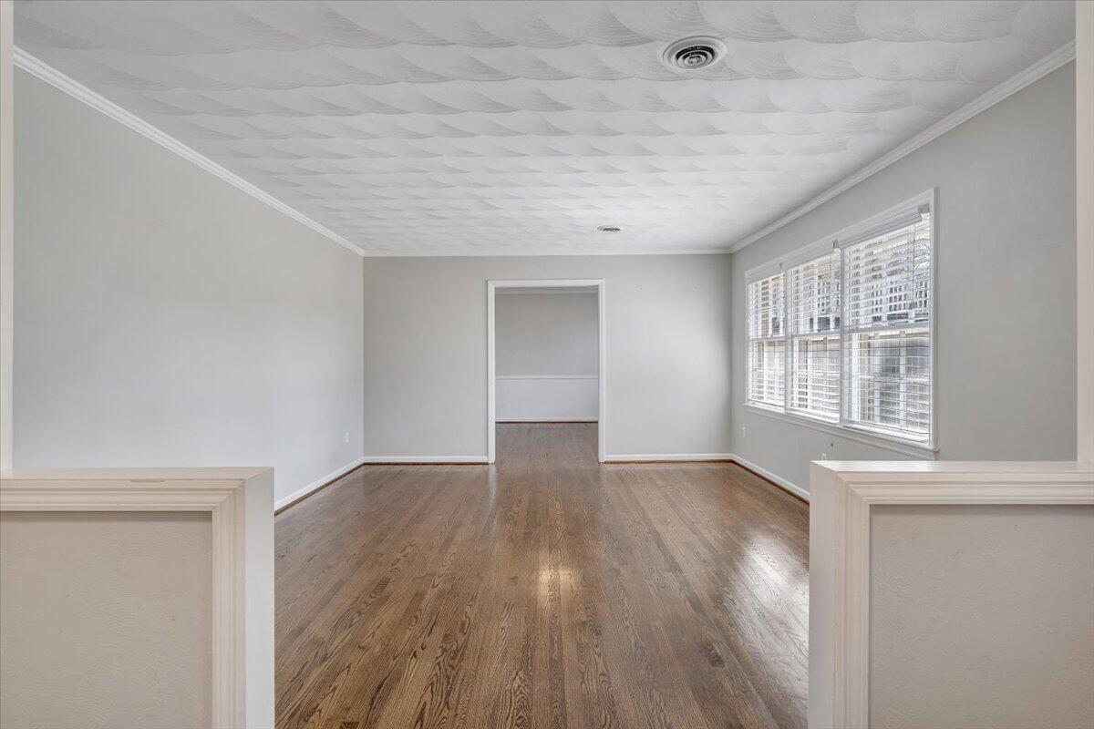 501 Darwin Road Southwest Roanoke, VA 24014 - Photo 11 of 37 an empty room with wooden floor and windows