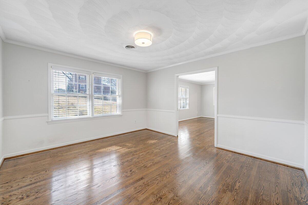 501 Darwin Road Southwest Roanoke, VA 24014 - Photo 14 of 37 an empty room with wooden floor and windows