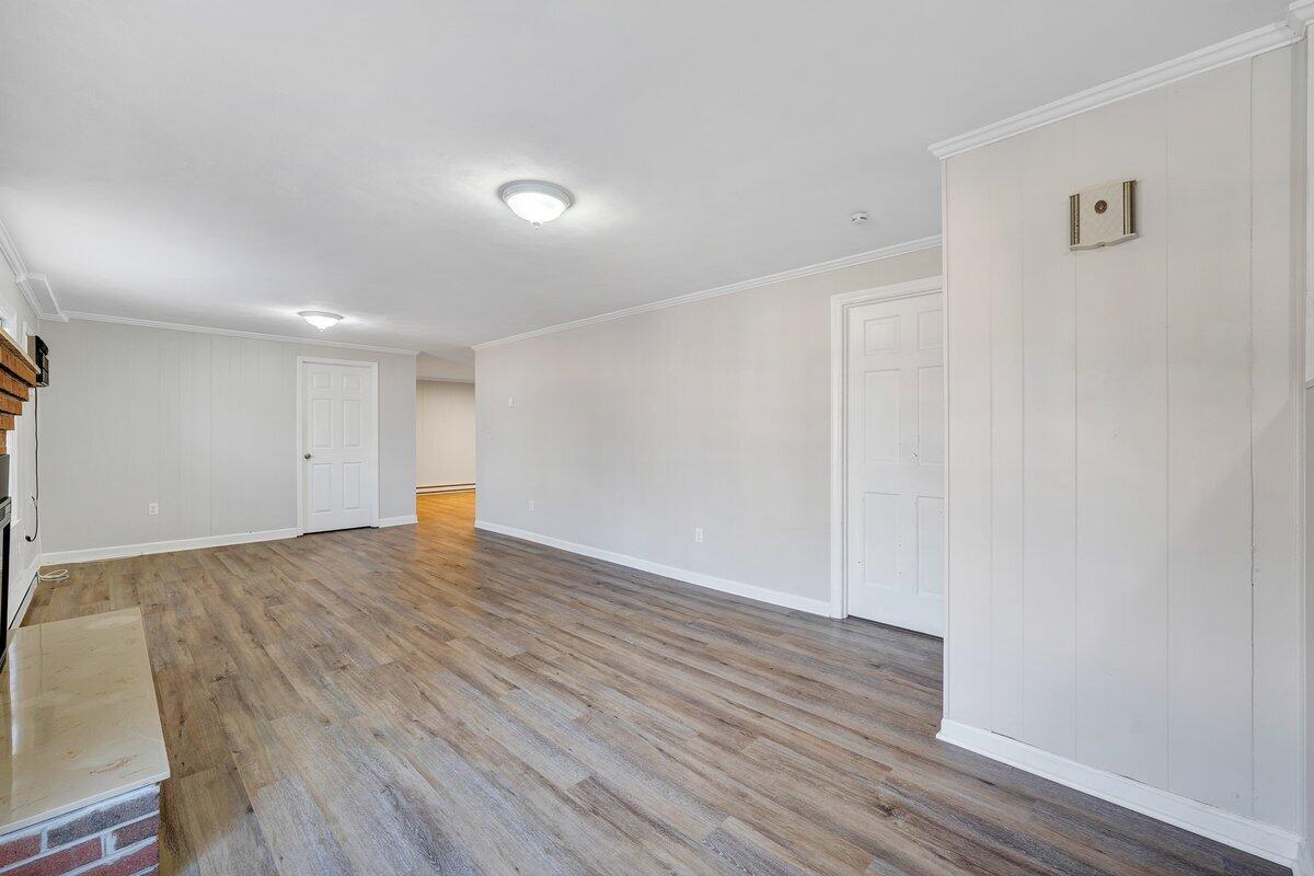 501 Darwin Road Southwest Roanoke, VA 24014 - Photo 27 of 37 a view of an empty room with wooden floor