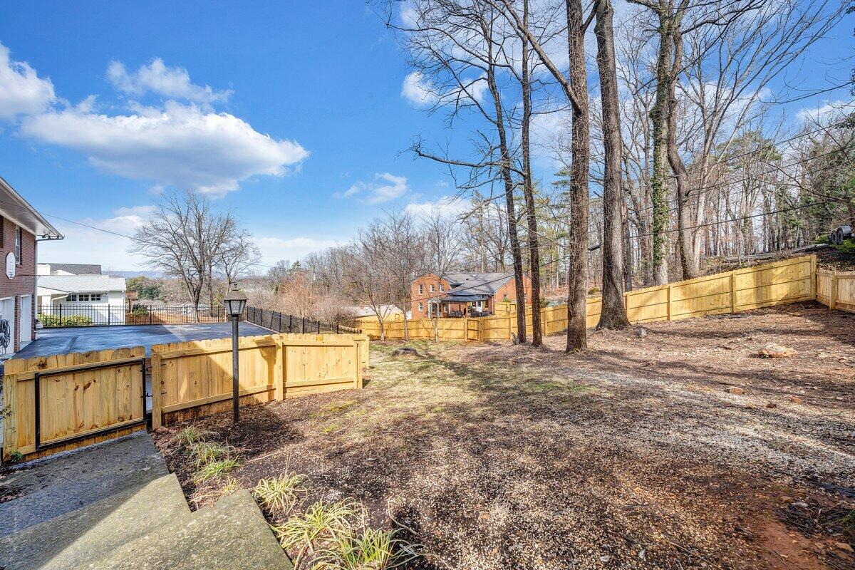 501 Darwin Road Southwest Roanoke, VA 24014 - Photo 6 of 37 a view of a yard with trees in the background